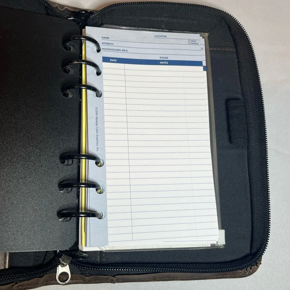 Day Timer Brown Folder With Some Papers